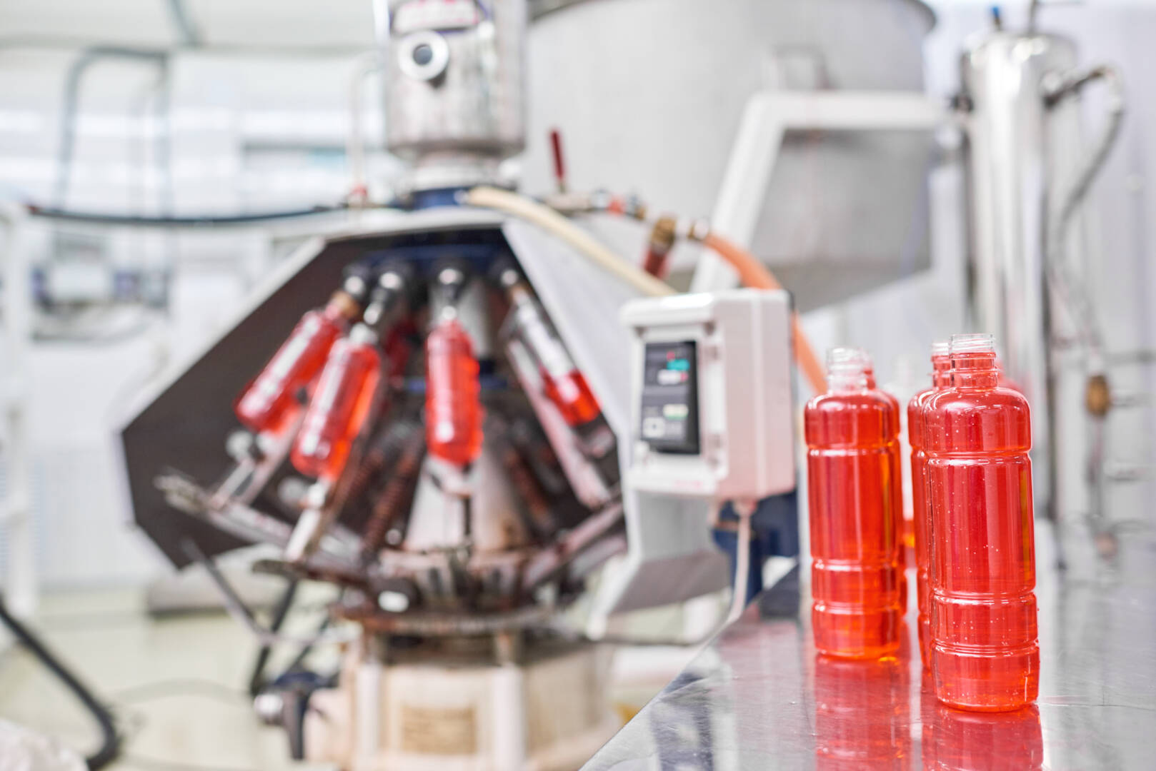 Bottles with sports drink at factory